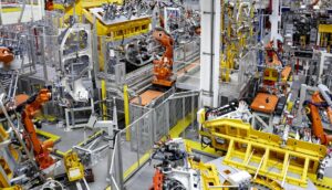 Robots putting cars together in a factory